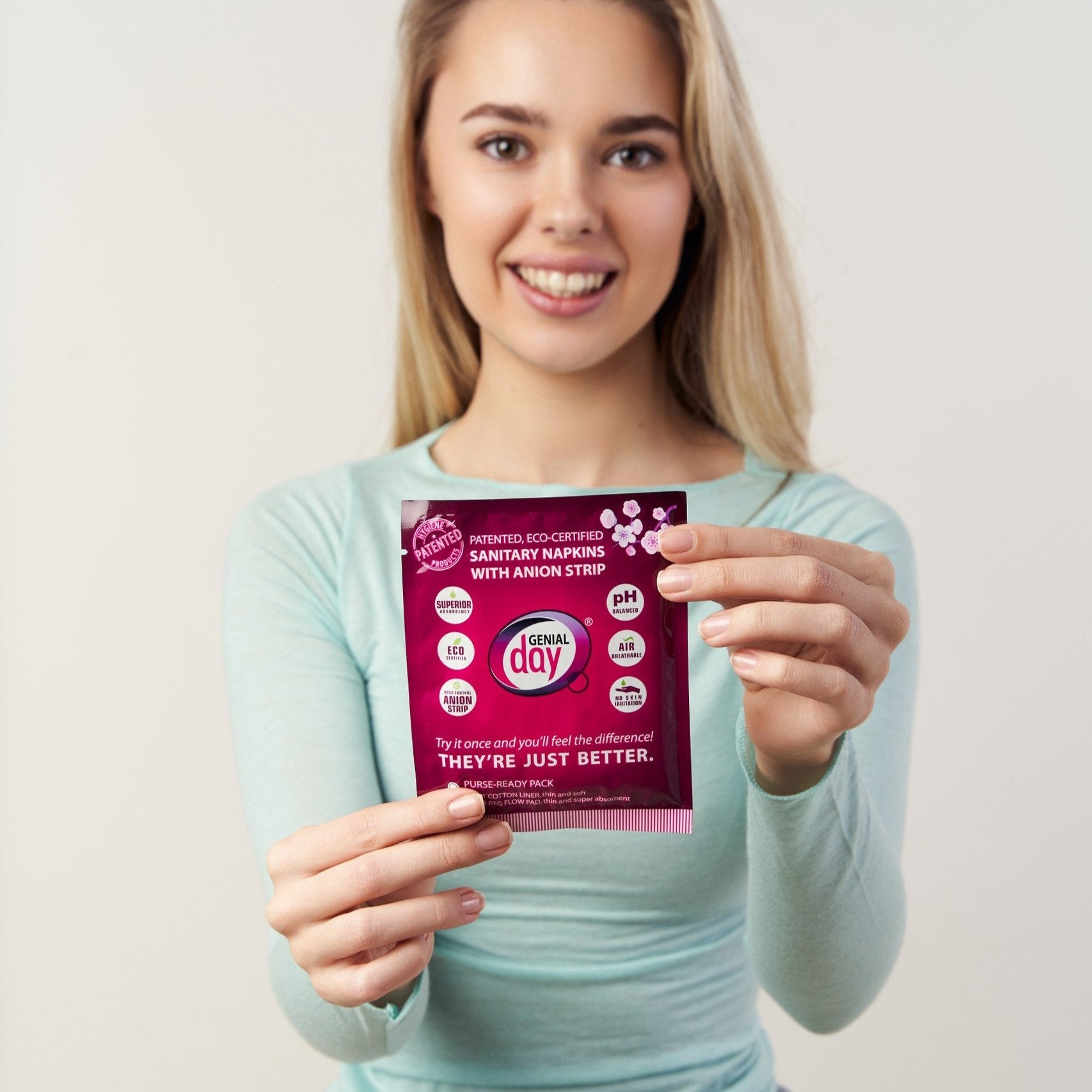 Girl holding Genial Day purse ready pack