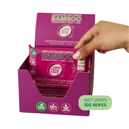 Box of Genial Day bamboo wet wipes with a hand reaching for one, on a white background